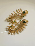 Gold peacock drop earrings with green stones and pearl detailing