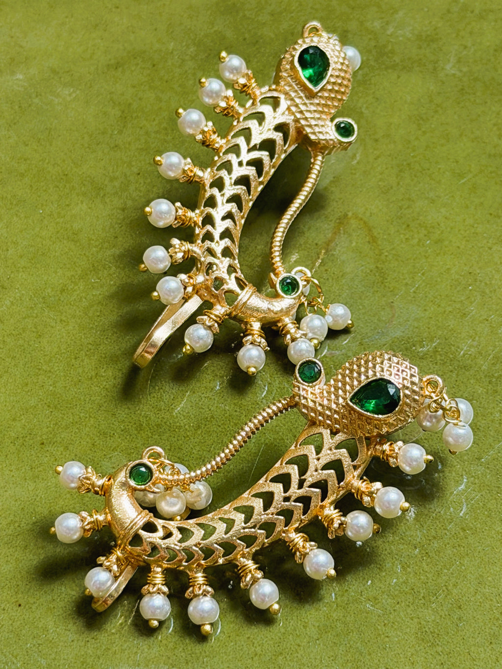 Traditional Indian earrings with peacock motif and pearl embellishments