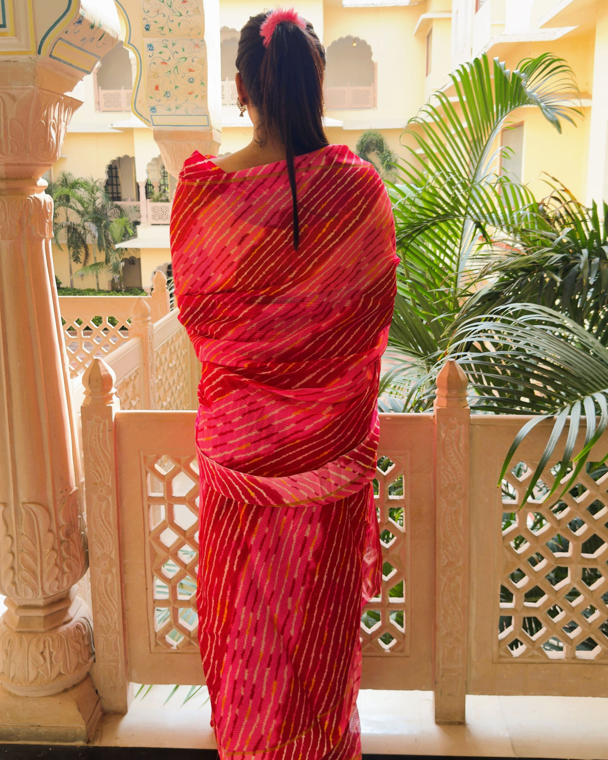 Multi red shade lehriya semi kota doria saree with unstitched blouse piece included