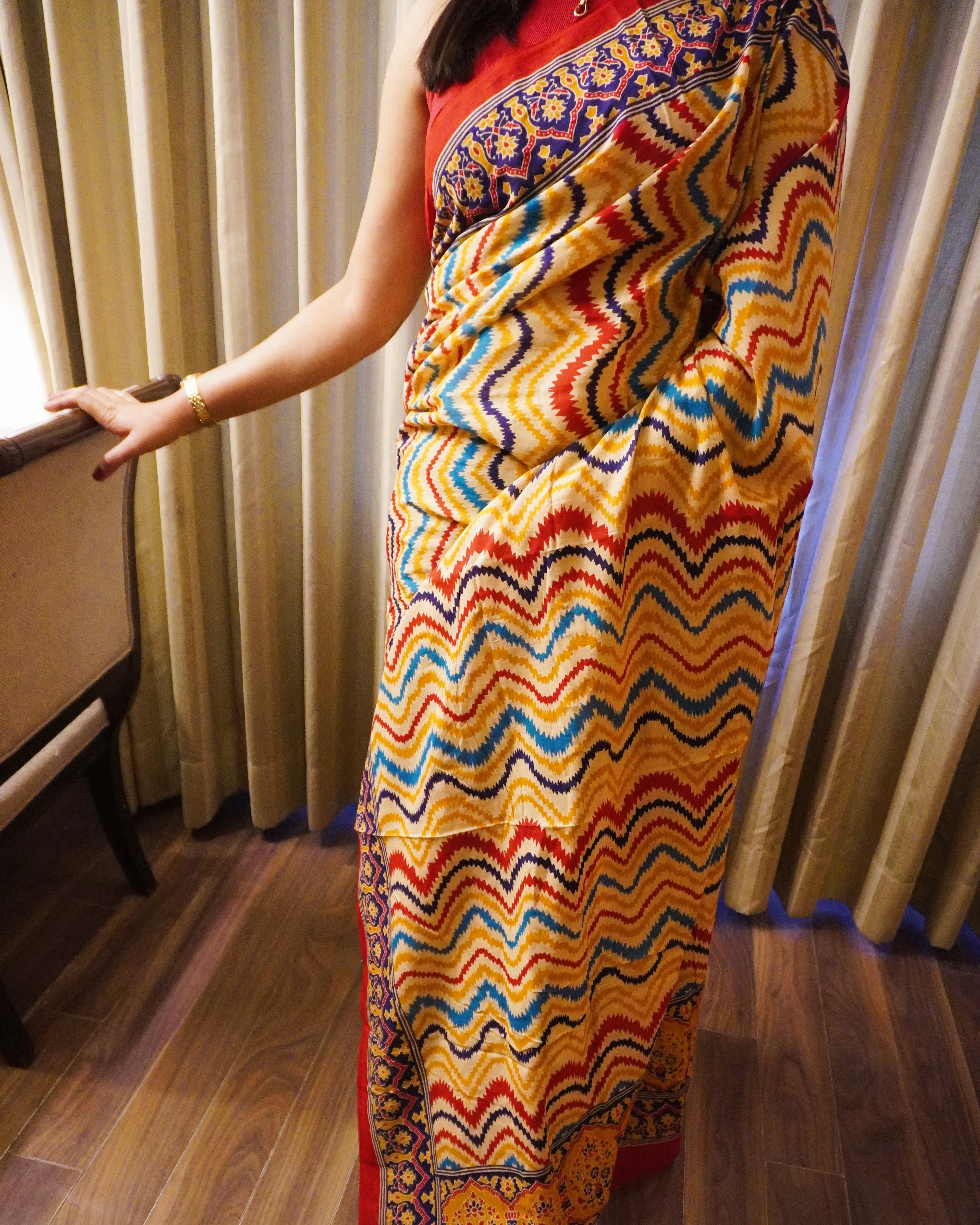 Close up of multicolour zigzag print on cotton saree fabric