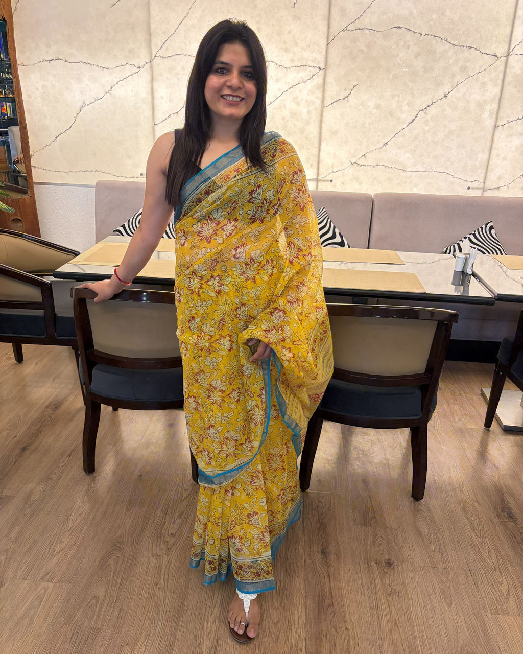 Mustard yellow Kota Doria floral print saree with teal border