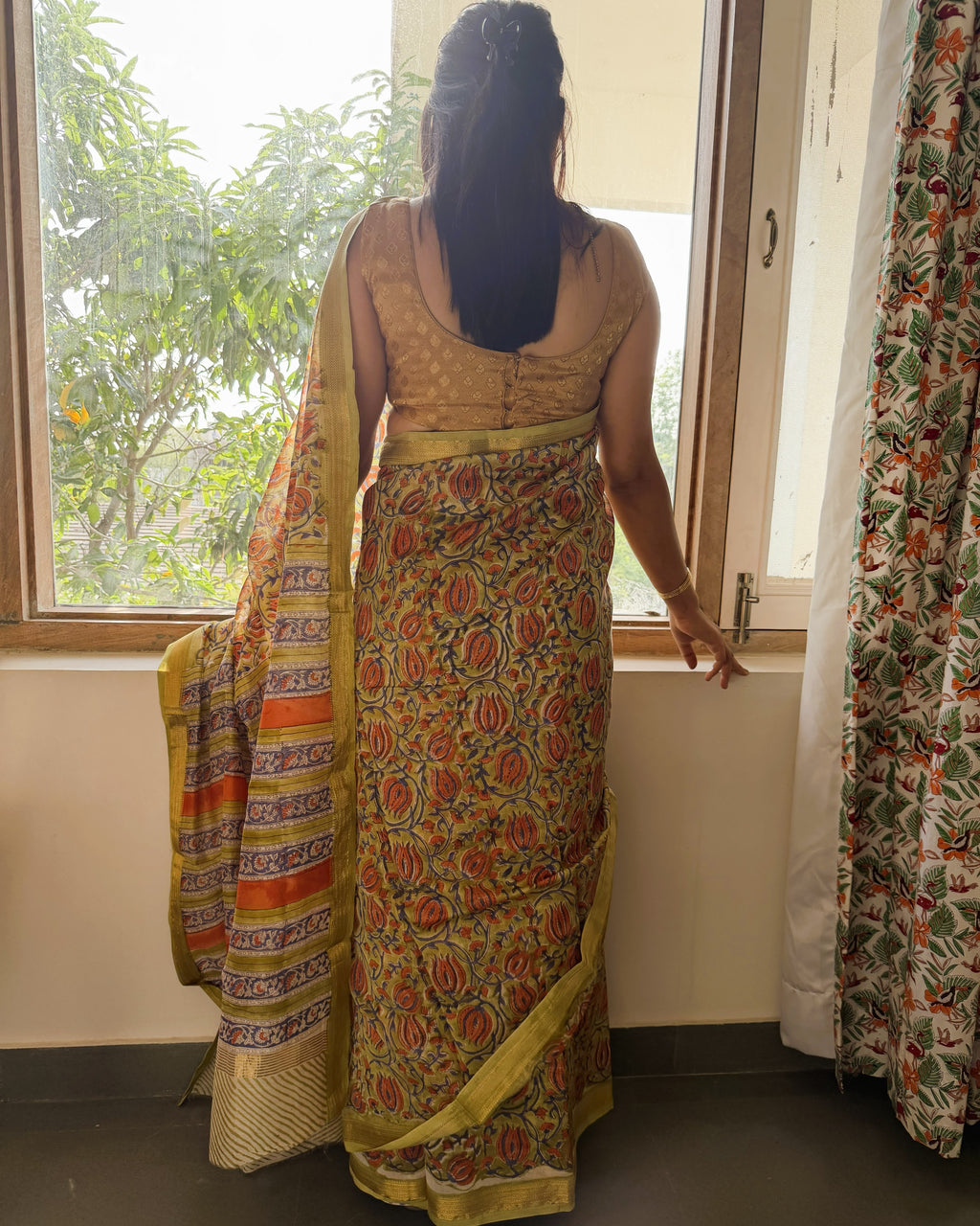 back view olive green maheshwari silk saree with detailed border