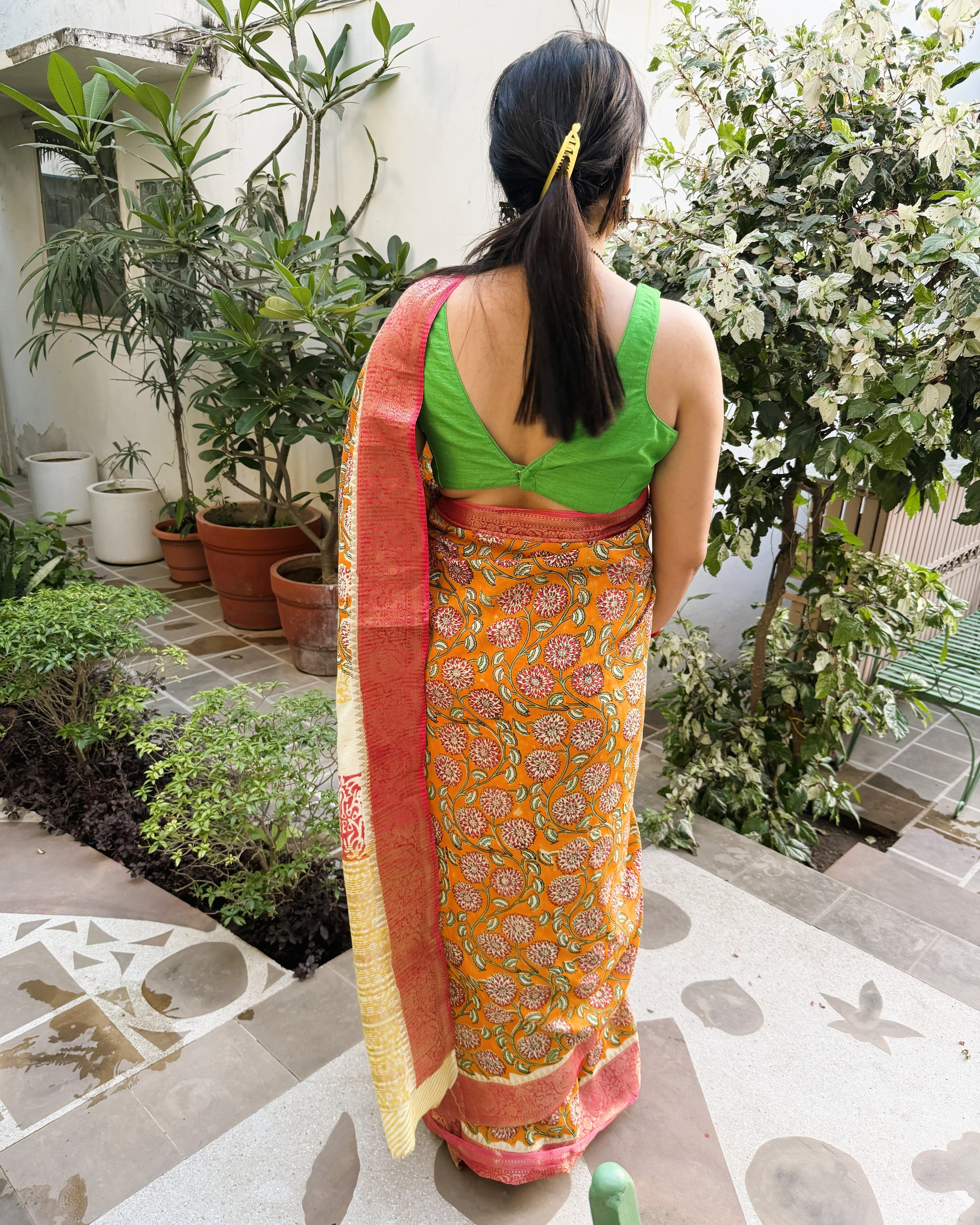 back view orange sanganeri modal silk saree with pallu