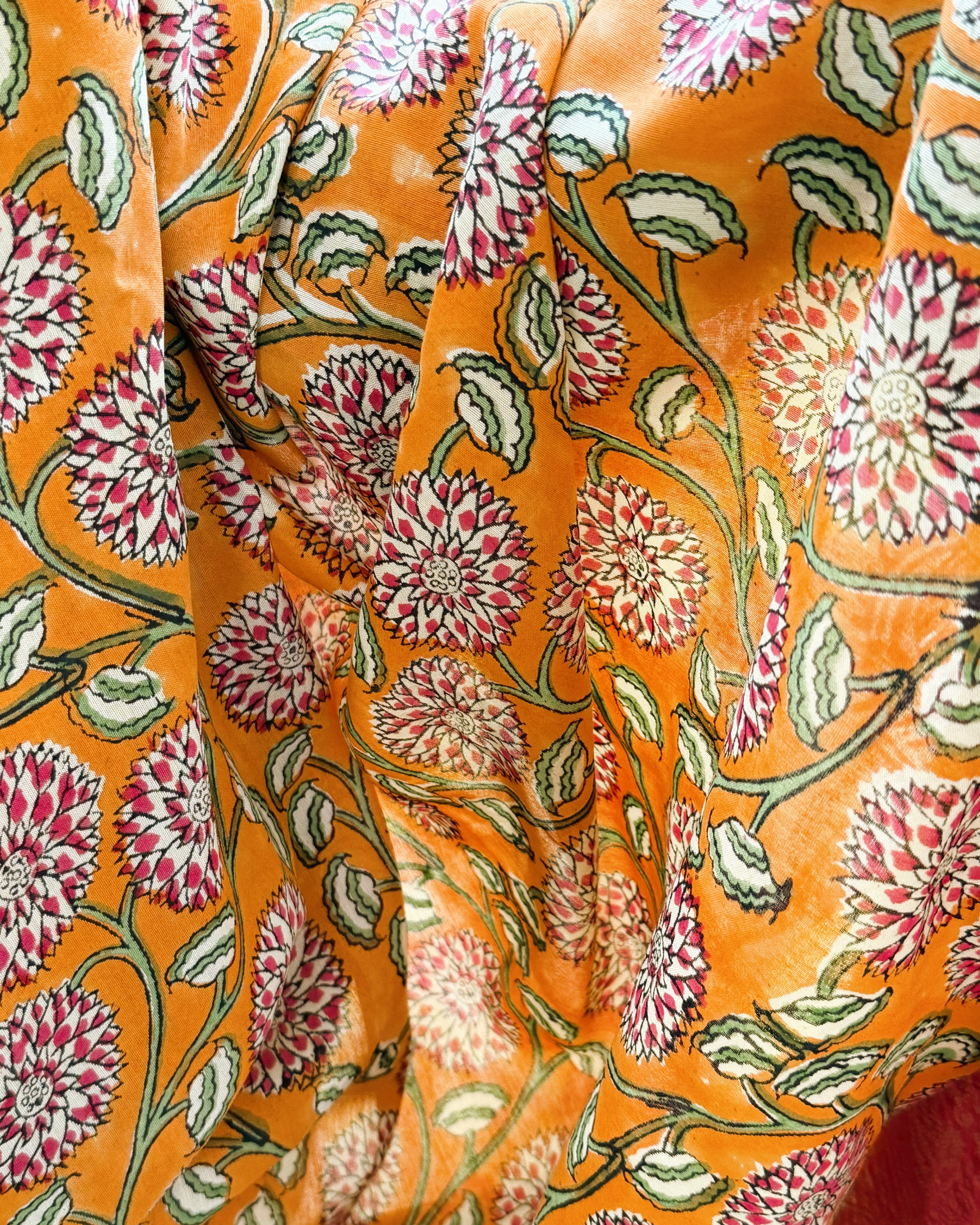 close up sanganeri floral print orange modal silk saree