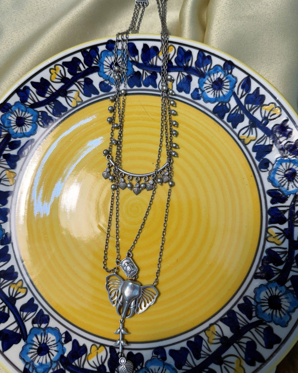 Detailed view of oxidised brass multi-strand chain with tiny bead drops from the Ganesha Bloom necklace set