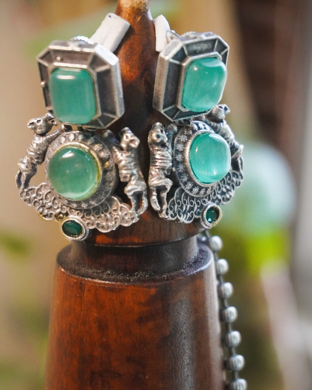 Detailed view of the oxidised silver ball chain of the Sher-e-Hara pendant necklace set against a natural backdrop
