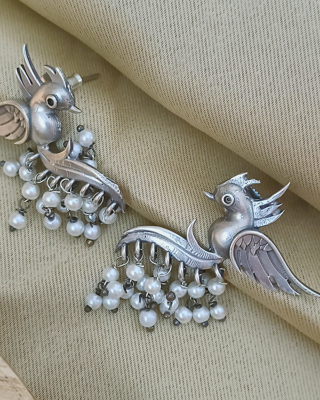 Festive oxidised earrings with pearl drops and intricate craftsmanship