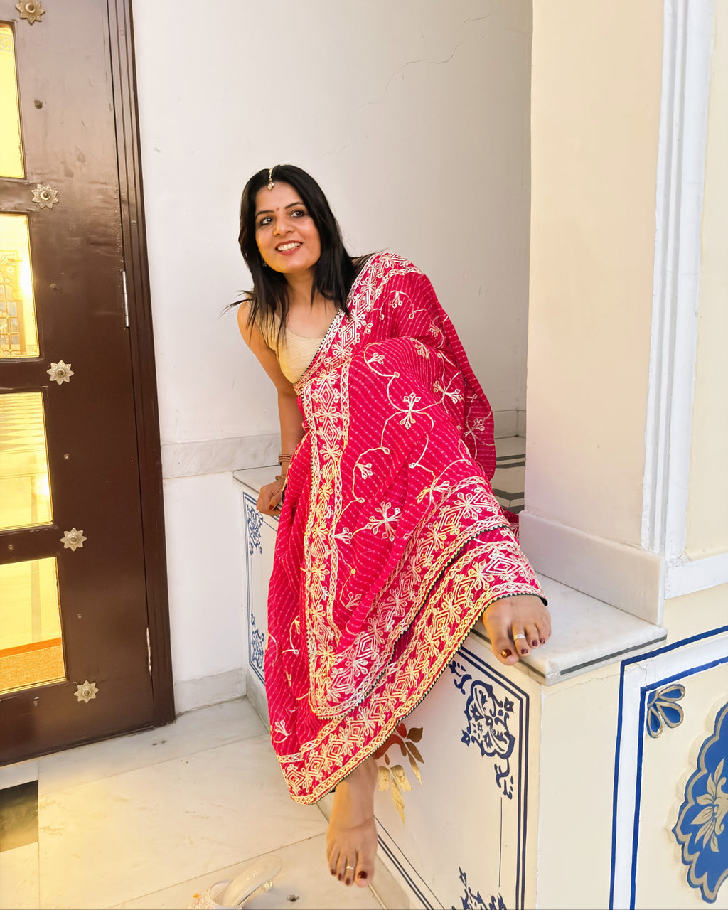 Detailed view of Gotta Patti border on pink Lehariya saree