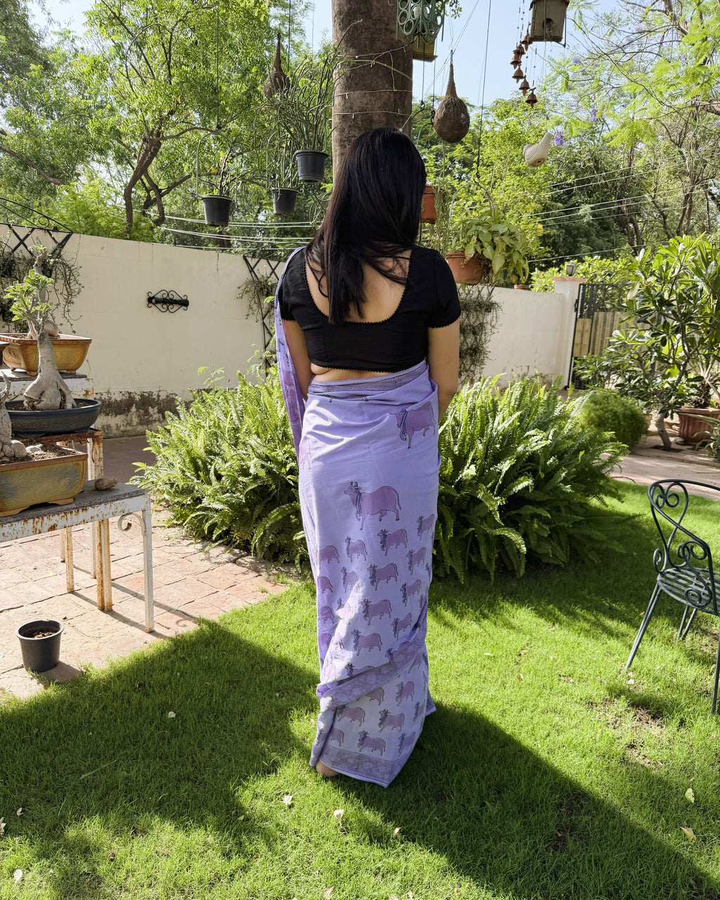 back view purple cow print saree mul cotton