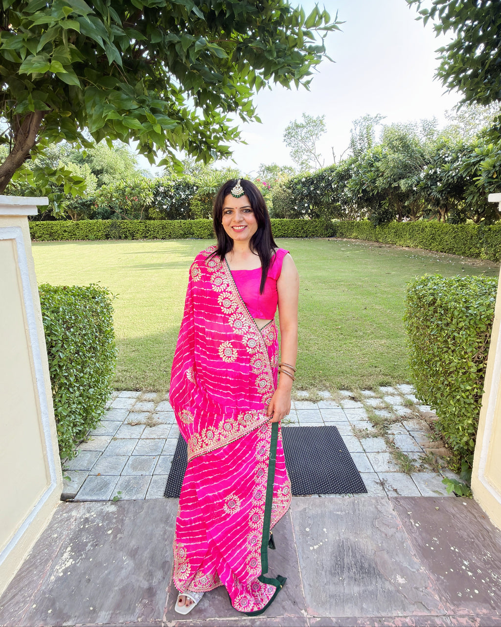 Rajasthani magenta pink Lehariya Gotta Patti georgette saree with green border