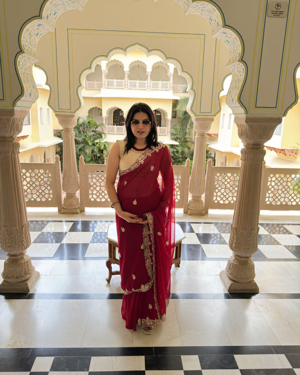 Rani red georgette saree with intricate Gotta Patti Pitten work and floral motifs