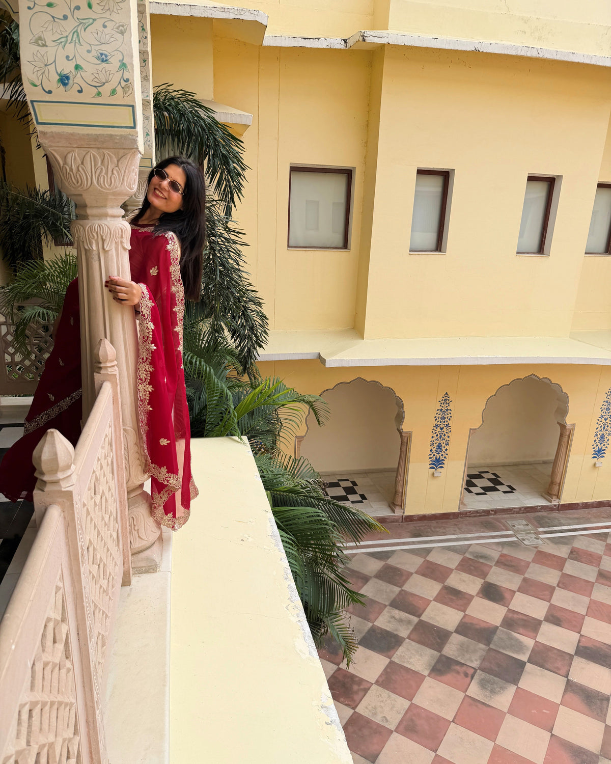 Traditional Rani red saree with intricate Gotta Patti Pitten embellishment