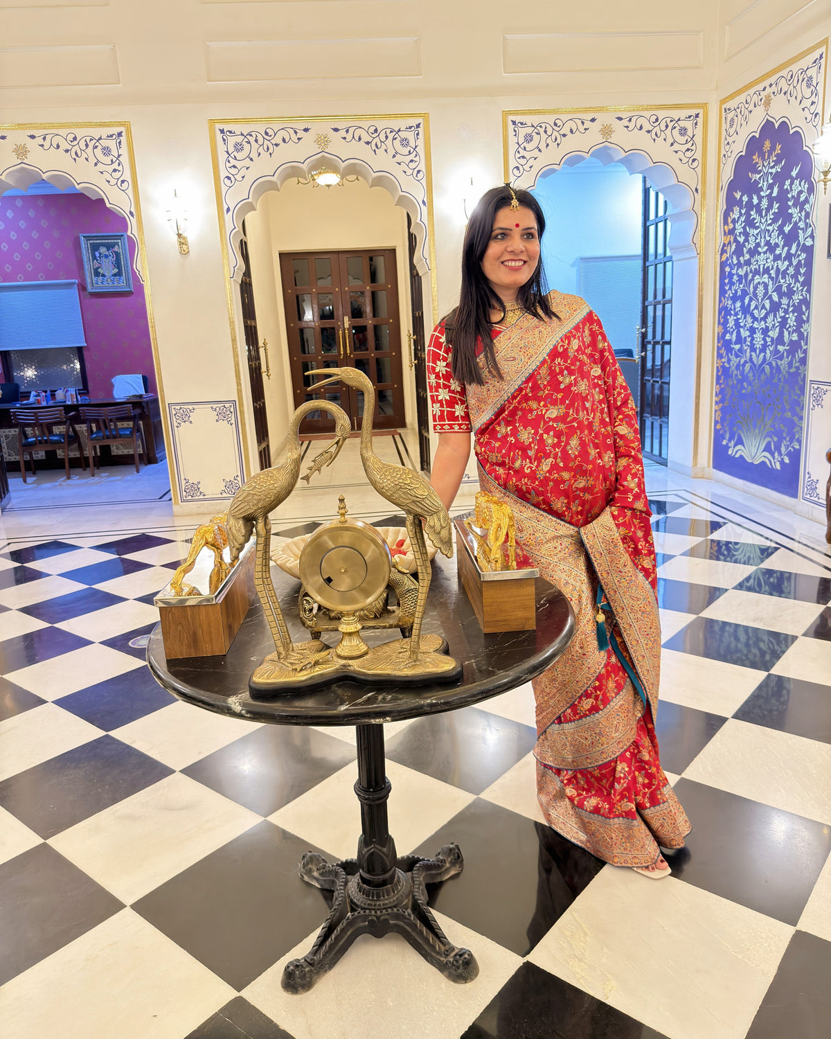 Raven Red Kashmiri saree featuring multicolor floral and vine motifs