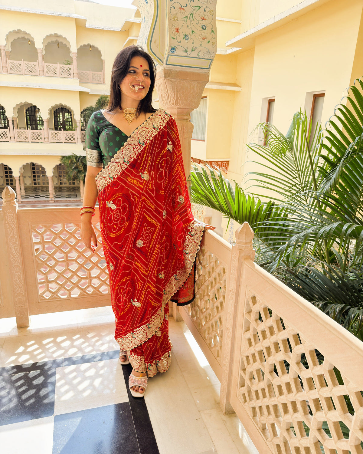Traditional red Bandhani georgette saree with ornate Gotta Patti detailing