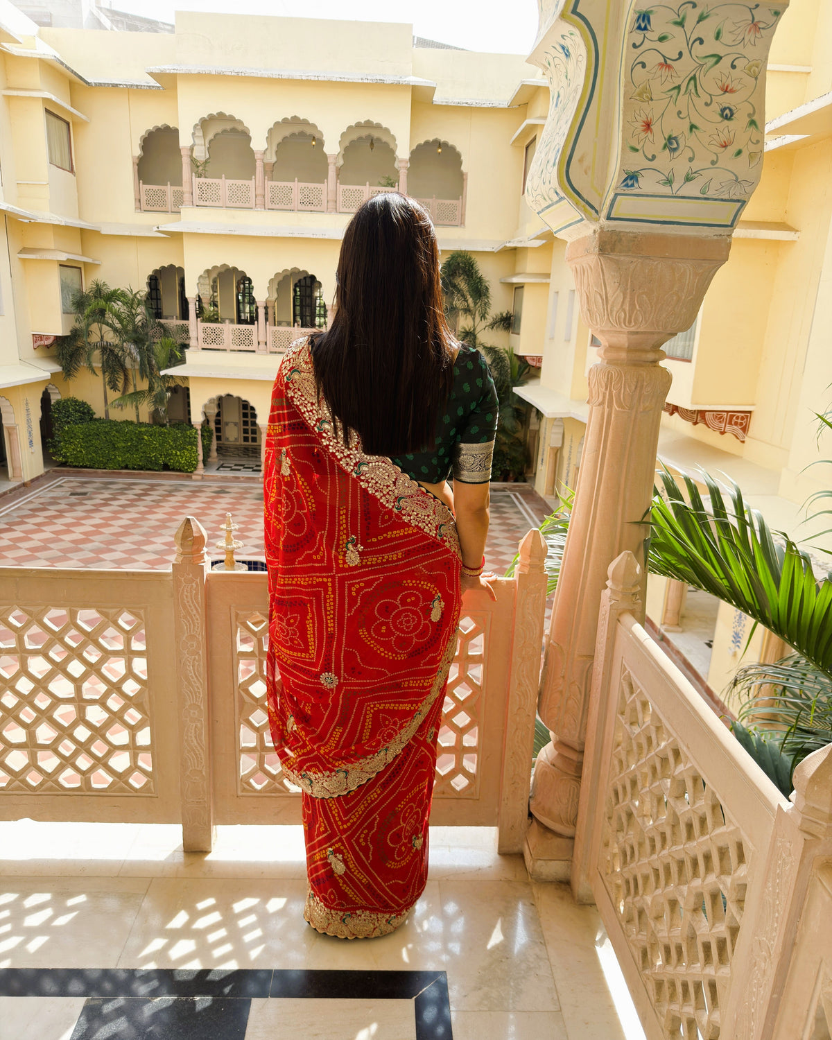Red Bandhani saree with intricate floral Gotta Patti detailing