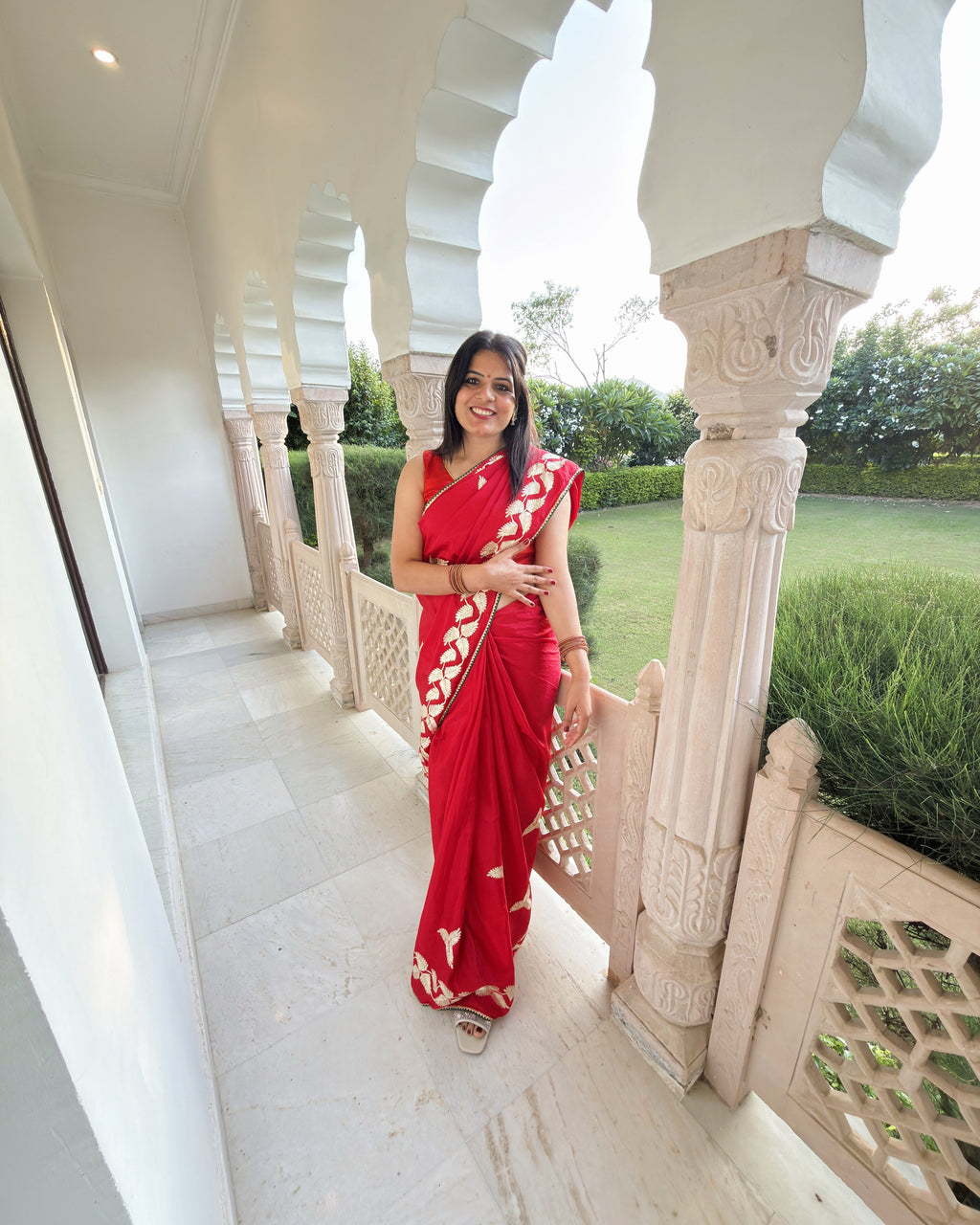 Traditional red Chinnon Silk saree with Gotta Patti embellishment