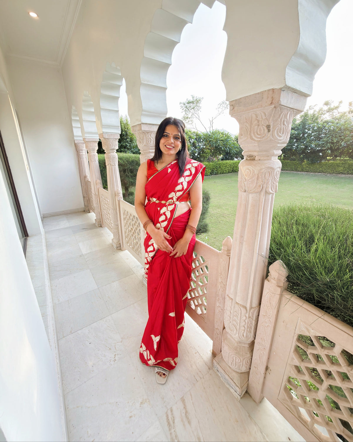 Red Chinnon Silk saree with floral and leaf Gotta Patti motifs for bridal look