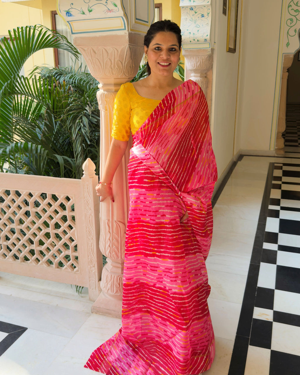 Border detail of red lehriya semi kota doria saree with fine wave stripes