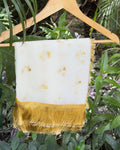 White golden net dupatta with scattered floral motifs and tassel border
