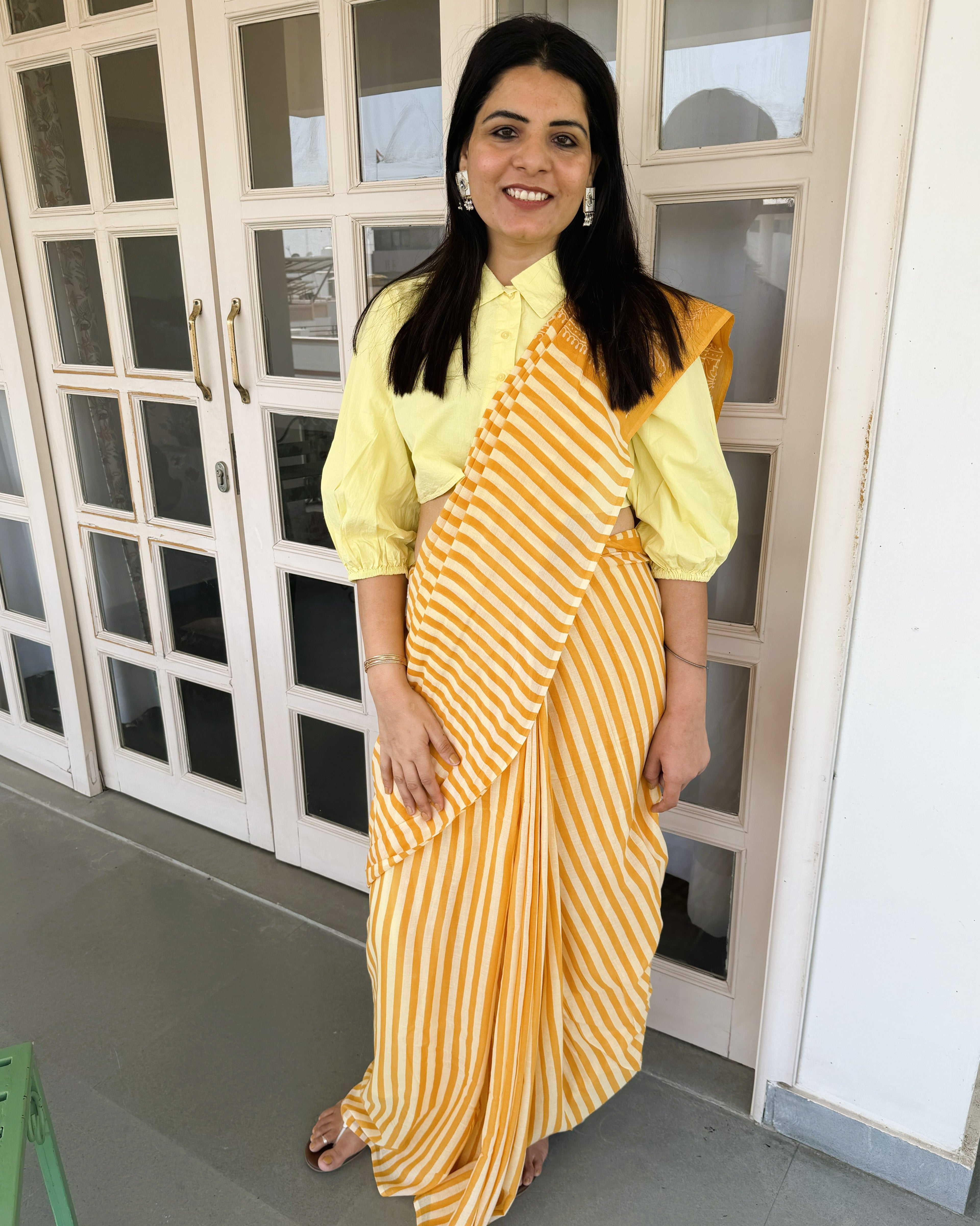 close up yellow orange stripe pattern mul cotton saree